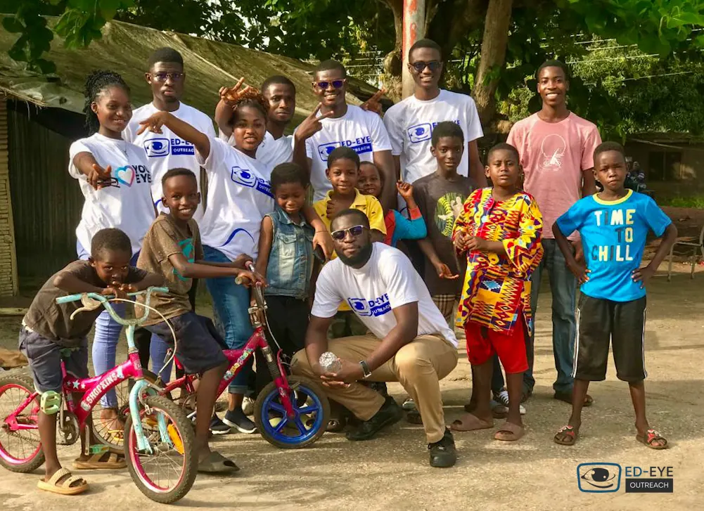 ED-EYE volunteers and children together during an outreach