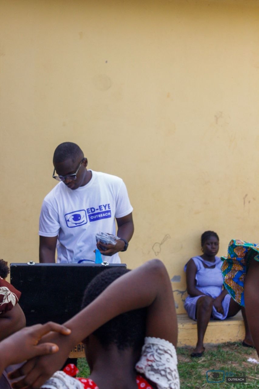 ED-EYE team member preparing equipment and supplies during outreach
