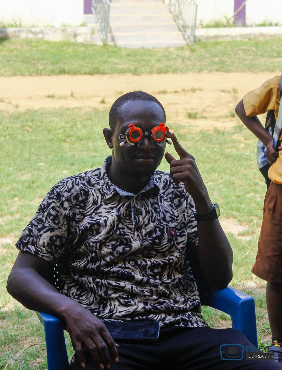 Community member wearing trial frames during a vision assessment